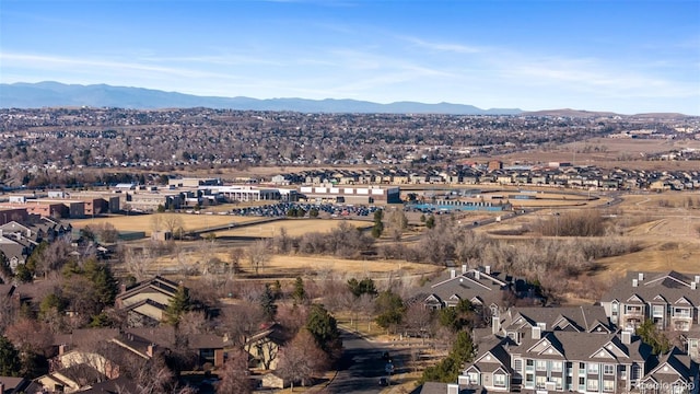 birds eye view of property with a mountain view