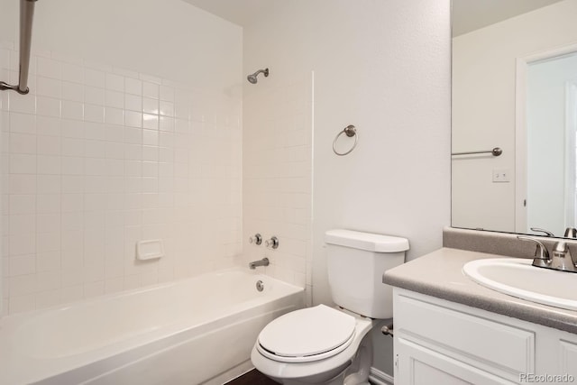 full bathroom featuring bathing tub / shower combination, vanity, and toilet