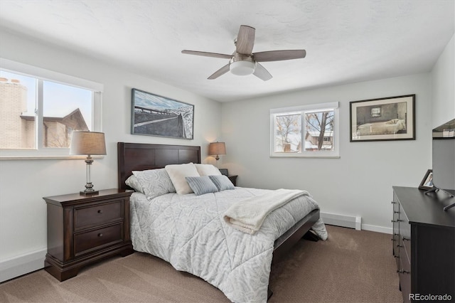 carpeted bedroom featuring baseboard heating, ceiling fan, and multiple windows