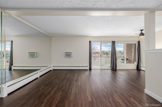 empty room with a baseboard heating unit, dark hardwood / wood-style floors, and a textured ceiling