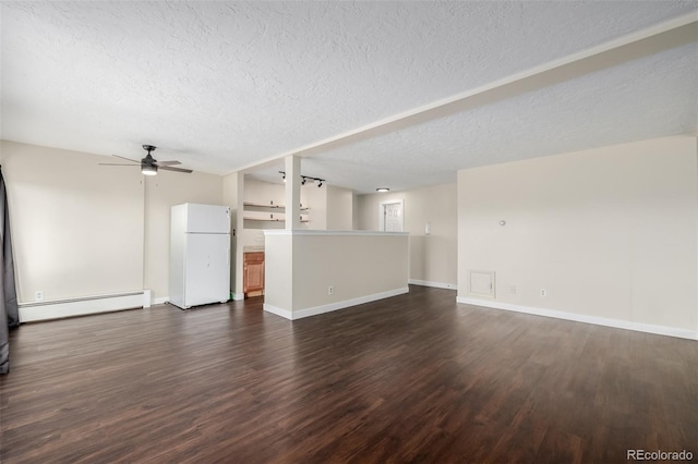 unfurnished living room with ceiling fan, a baseboard heating unit, a textured ceiling, and dark hardwood / wood-style floors