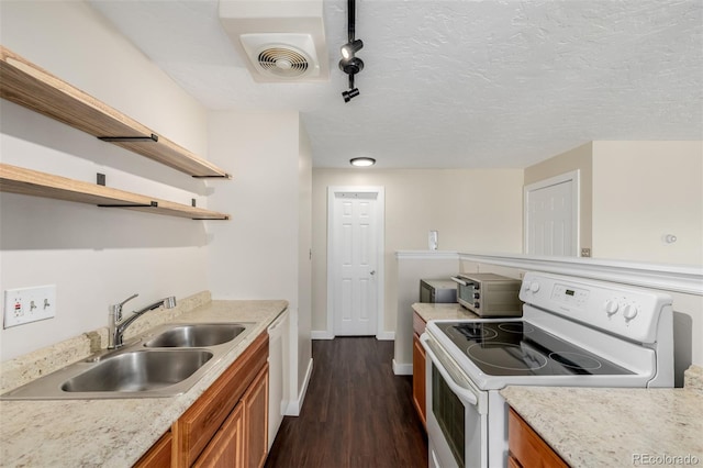 kitchen with sink, white appliances, track lighting, a textured ceiling, and dark hardwood / wood-style flooring