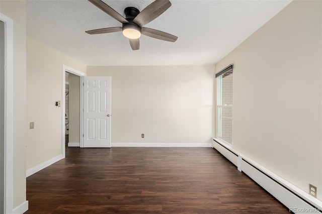 spare room featuring a textured ceiling, dark wood-type flooring, ceiling fan, and baseboard heating