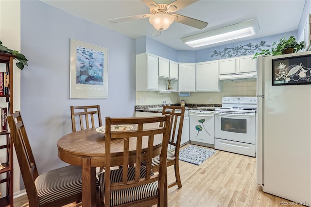 kitchen featuring white appliances, ceiling fan, tasteful backsplash, light hardwood / wood-style floors, and white cabinets