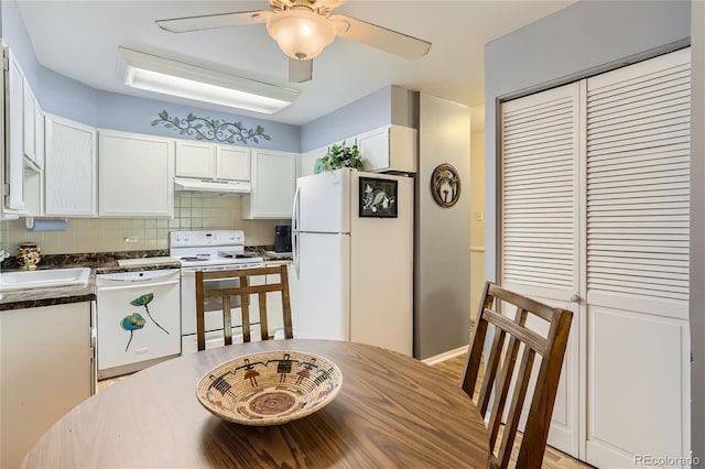 kitchen with white cabinetry, sink, backsplash, ceiling fan, and white appliances