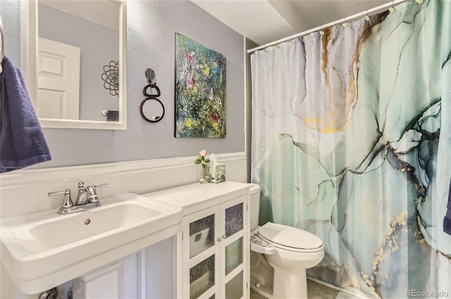 bathroom with sink and toilet