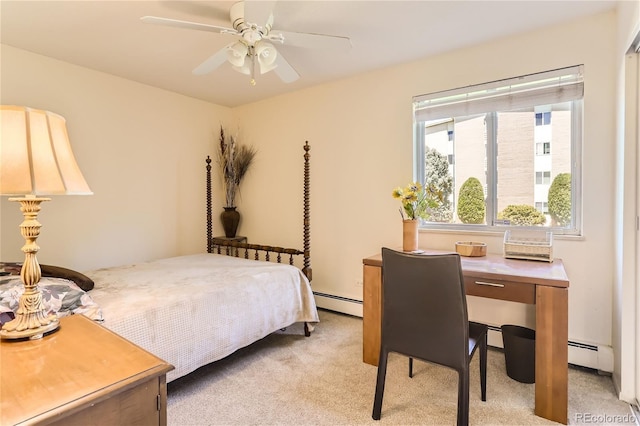 carpeted bedroom featuring a baseboard radiator and ceiling fan