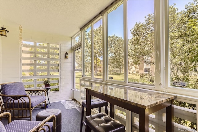 sunroom / solarium featuring a wealth of natural light