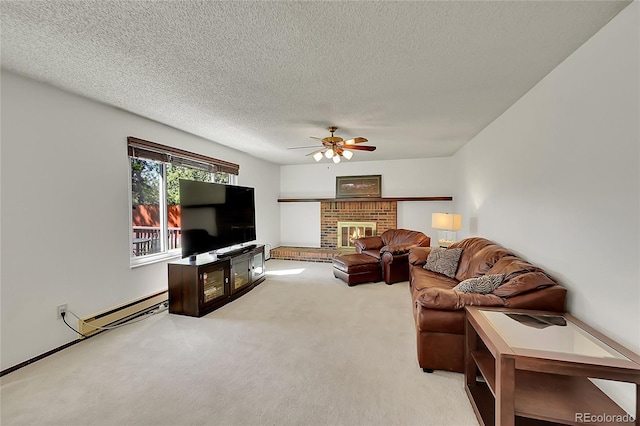 living area featuring ceiling fan, baseboard heating, carpet floors, a brick fireplace, and a textured ceiling