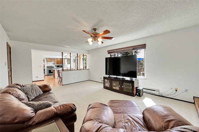 carpeted living room with a baseboard radiator, a ceiling fan, and a textured ceiling