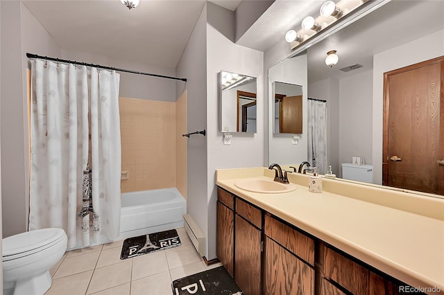 bathroom featuring baseboard heating, vanity, toilet, tile patterned floors, and visible vents