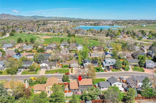birds eye view of property with a residential view, view of golf course, and a water and mountain view