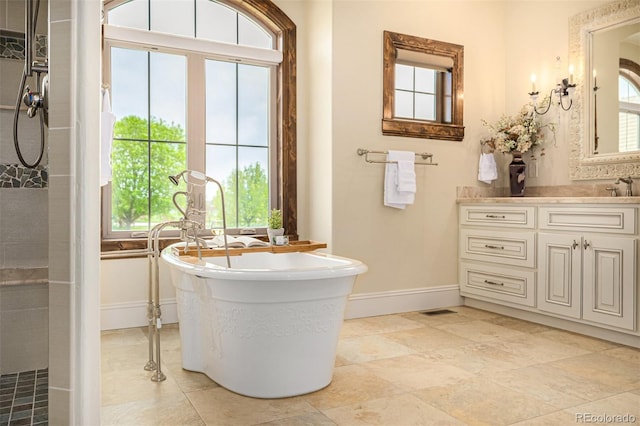 bathroom featuring vanity, tile floors, and a wealth of natural light