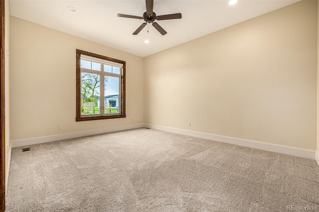 empty room featuring carpet floors and ceiling fan