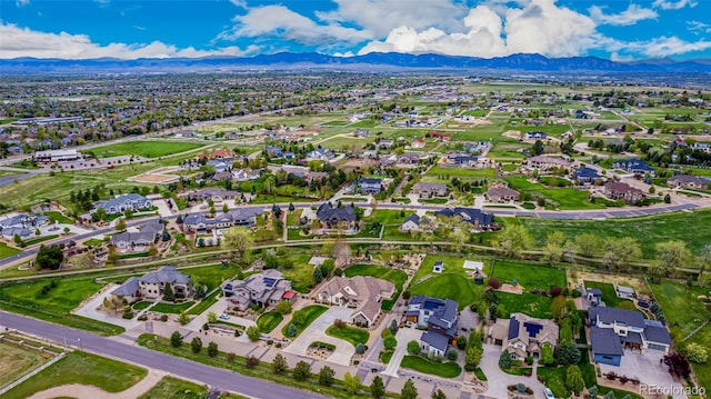 birds eye view of property with a mountain view