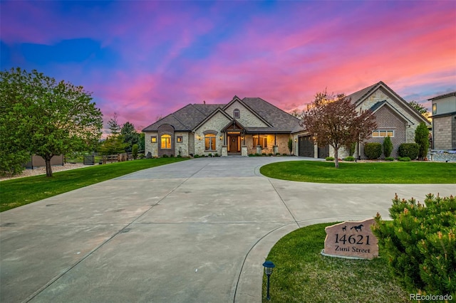 french country style house with a yard