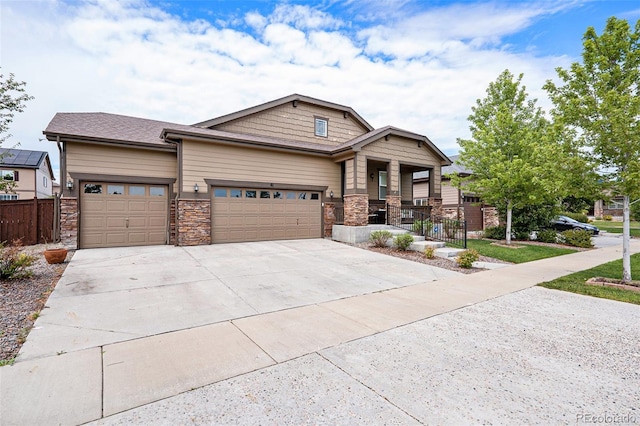 craftsman house with a garage and covered porch