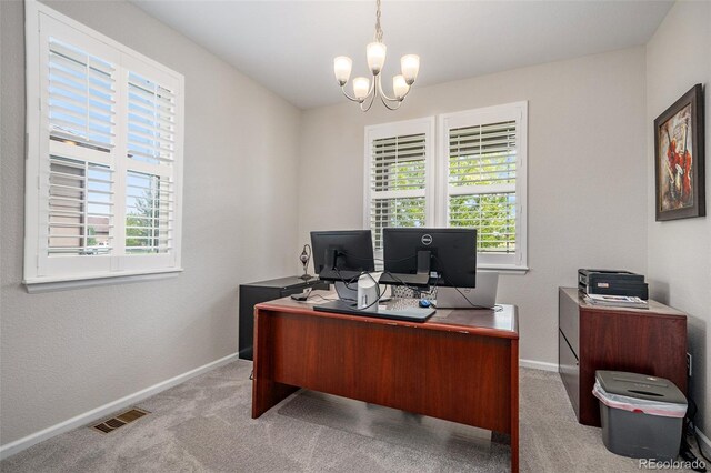 office featuring a chandelier, carpet, and a wealth of natural light