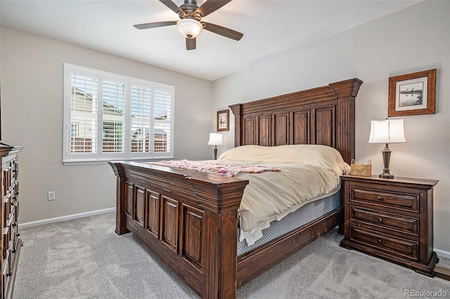 bedroom featuring ceiling fan and light colored carpet