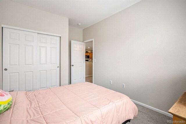 bedroom with a closet and carpet floors