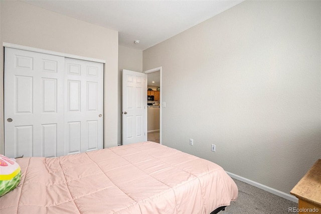 bedroom featuring a closet and carpet