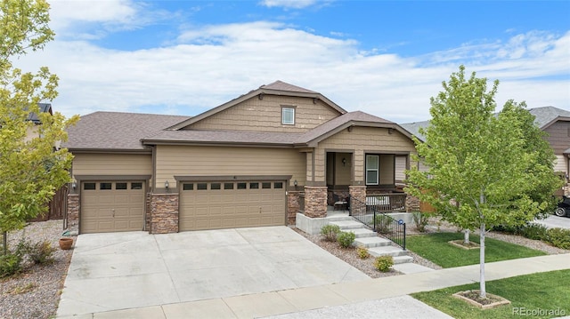 craftsman-style home with a garage and covered porch