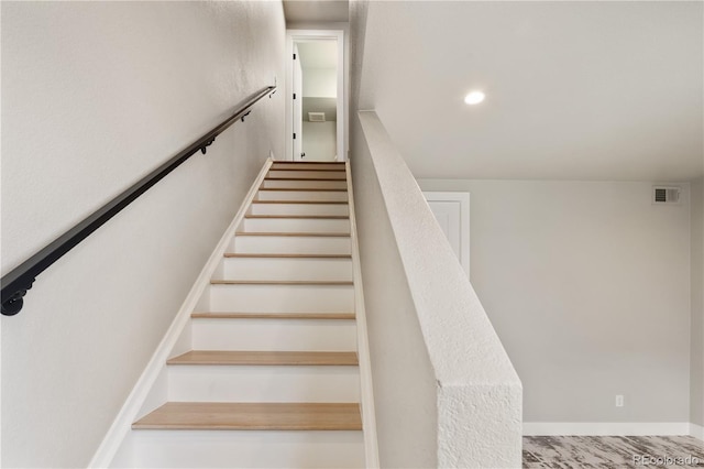 stairway with recessed lighting and visible vents