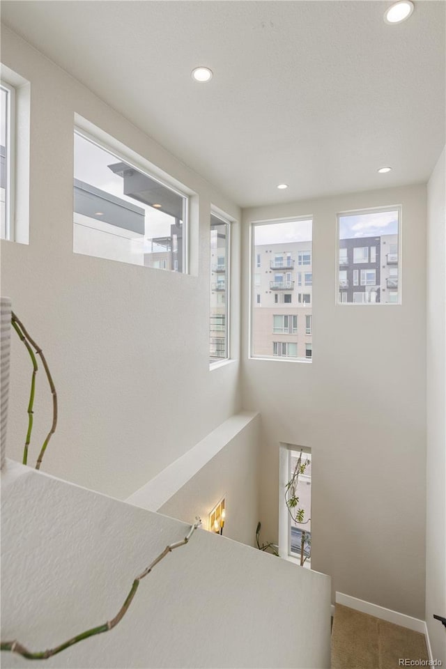 bedroom featuring carpet, baseboards, and recessed lighting