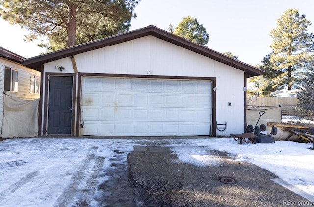 view of snow covered garage