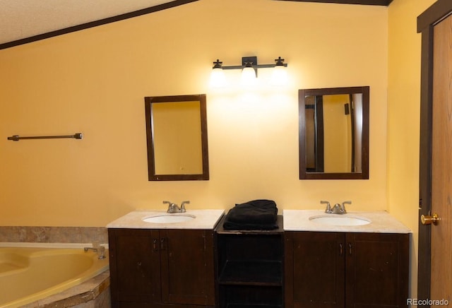 bathroom with vanity, tiled bath, vaulted ceiling, and ornamental molding