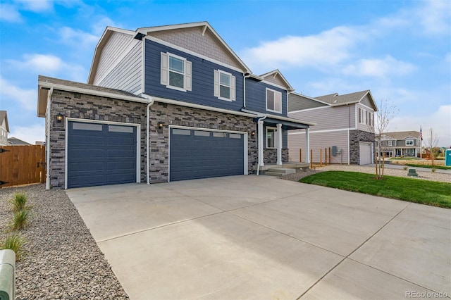 13466 Valentia St, Thornton, CO 80602 - view of front facade with stone siding, driveway, and an attached garage