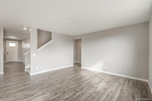 13466 Valentia St, Thornton, CO 80602 - unfurnished room with wood finished floors, baseboards, and stairway