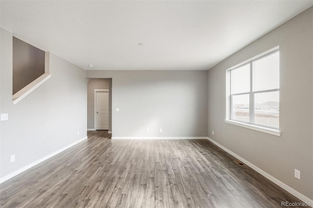 13466 Valentia St, Thornton, CO 80602 - empty room with wood finished floors and baseboards