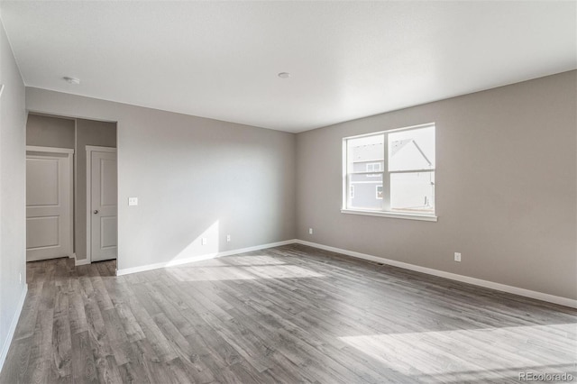 13466 Valentia St, Thornton, CO 80602 - spare room featuring wood finished floors and baseboards