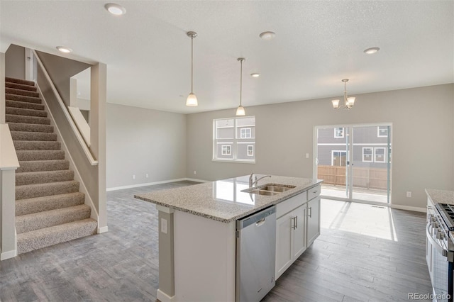 13466 Valentia St, Thornton, CO 80602 - kitchen with appliances with stainless steel finishes, a sink, light wood-style floors, healthy amount of natural light, and recessed lighting