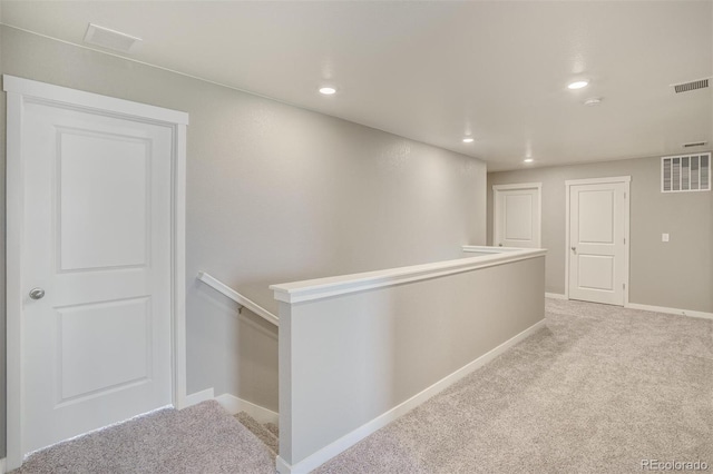 13466 Valentia St, Thornton, CO 80602 - hallway featuring an upstairs landing, light colored carpet, baseboards, and recessed lighting