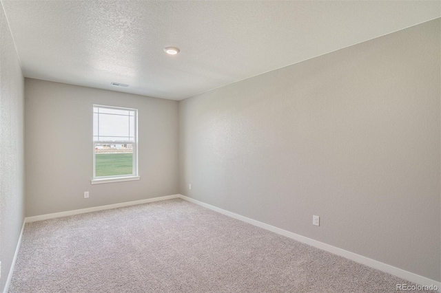 13466 Valentia St, Thornton, CO 80602 - unfurnished room featuring carpet flooring, a textured ceiling, and baseboards