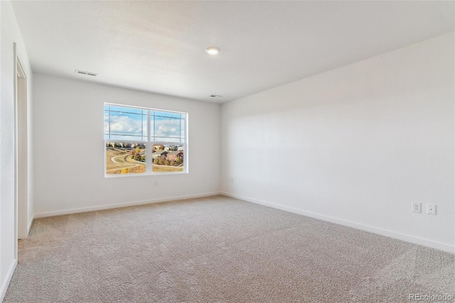 unfurnished room featuring carpet floors