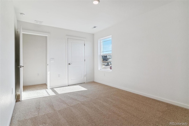 unfurnished bedroom with carpet floors