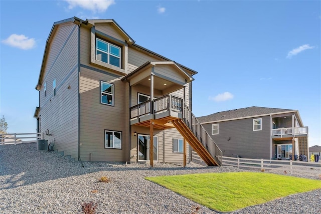 rear view of property with cooling unit