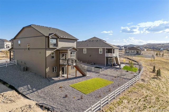 rear view of property with a balcony