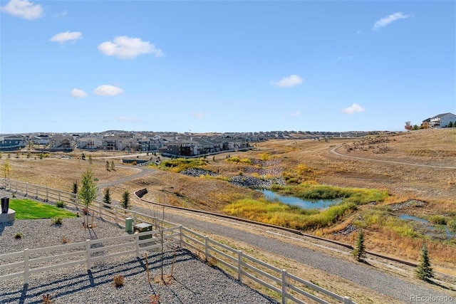 birds eye view of property with a rural view