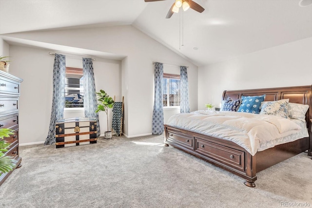 carpeted bedroom featuring a ceiling fan, vaulted ceiling, and baseboards