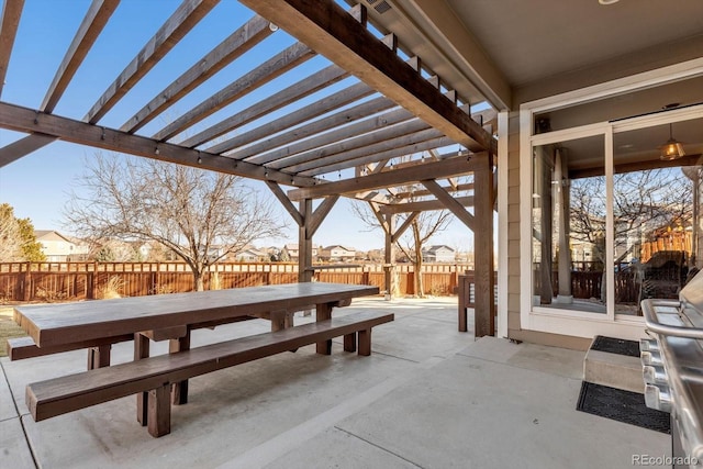 view of patio with outdoor dining area, a fenced backyard, and a pergola