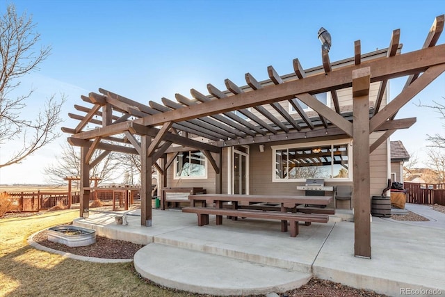 view of patio / terrace with a fire pit, grilling area, fence, and a pergola