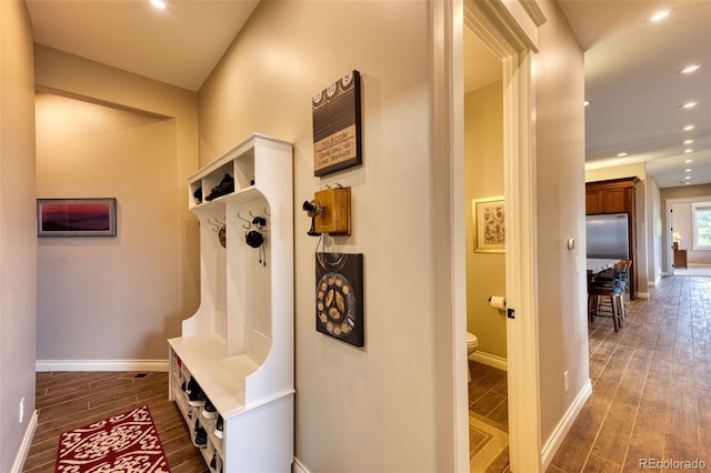 mudroom with wood-type flooring