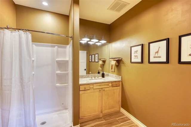 bathroom with vanity and a shower with curtain