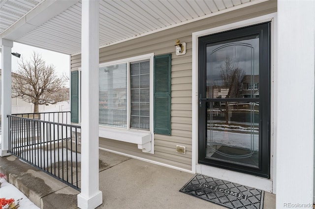 doorway to property with covered porch