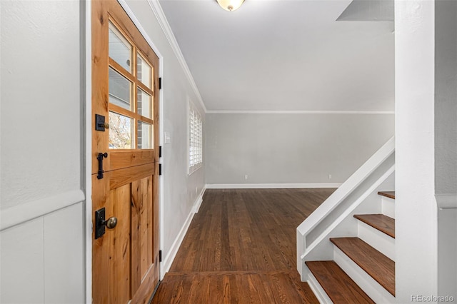 foyer featuring dark hardwood / wood-style floors and ornamental molding