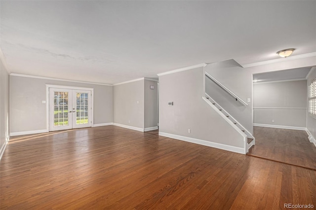 unfurnished living room featuring french doors, ornamental molding, and dark wood-type flooring